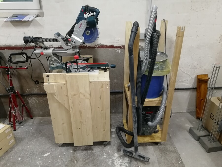 Vacuum and Miter Saw stowed away against the wall