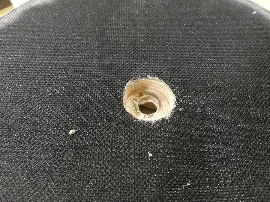 space for the nut, drilled through the velcro