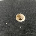 space for the nut, drilled through the velcro
